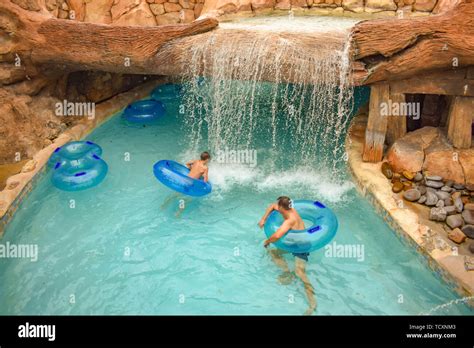 Orlando, Florida. April 07, 2019. Man and boy floating at Lazy River in ...