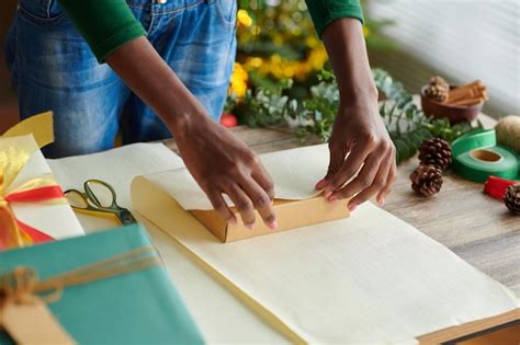 Premium Photo Woman Wrapping Christmas Presents