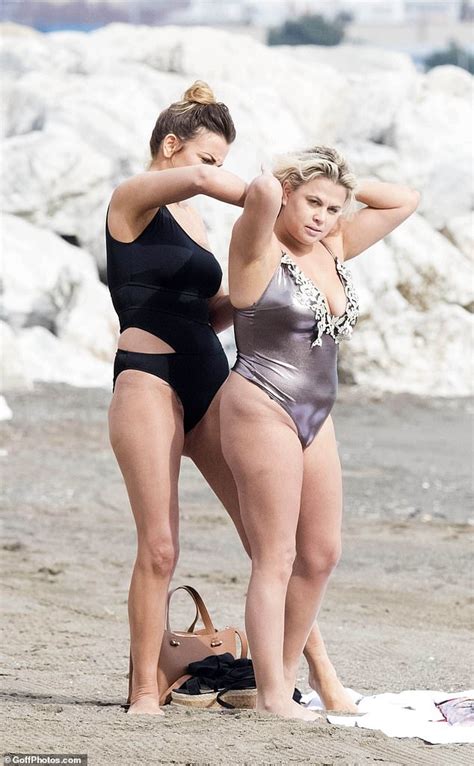 Lady Nadia Essex Wears Plunging Metallic Thong Swimsuit In Malaga