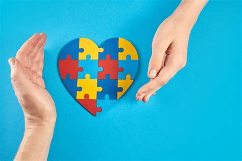 Premium Photo Father And Autistic Son Hands Holding Jigsaw Puzzle