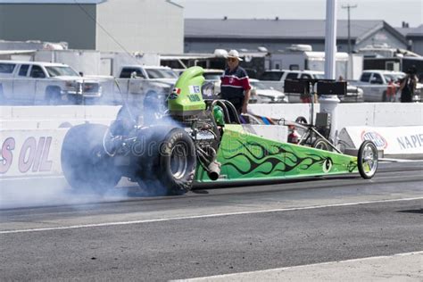 Top Fuel Dragster Making A Smoke Show On The Race Track At The Starting