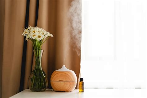 Premium Photo Aromatherapy Concept Aroma Oil Diffuser On The Table