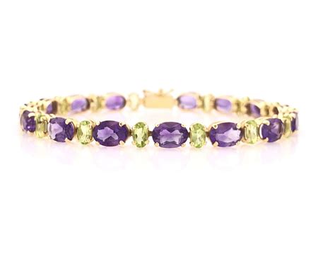 Lot 14K YELLOW GOLD AMETHYST PERIDOT TENNIS BRACELET