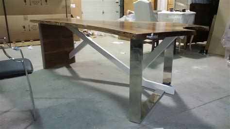 Custom Polished Stainless Steel Legs And Trim On A Black Walnut Slab