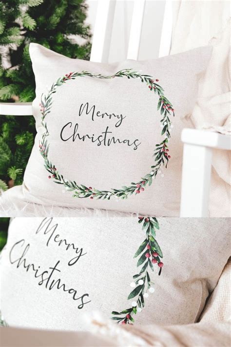 Two Christmas Pillows Sitting On Top Of A White Chair