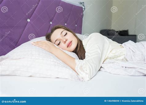 Beautiful Young Girl Sleeping In Her Bed In The Morning Health And