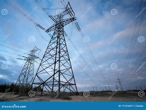 Silhouette High Voltage Electric Towers At Sunset Time High Voltage