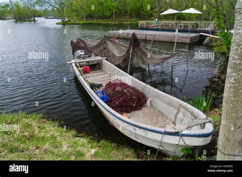 Small Fishing Boat With Nets On The Shore Of Lake Onuma Hokkaido