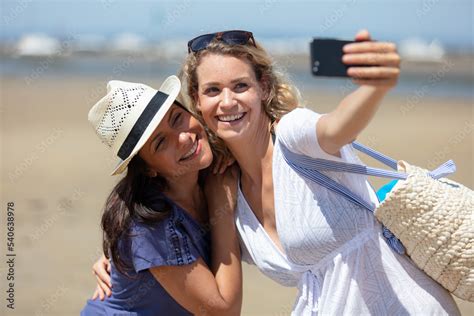 Two Women Taking Selfie On The Beach Stock Foto Adobe Stock