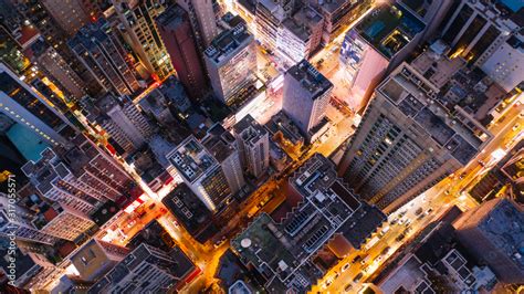 Aerial Top View Of Downtown District Buildings In Night City Light