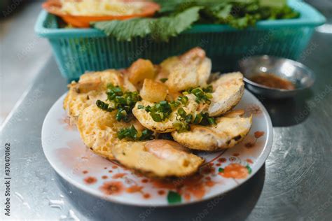 Vietnamese street food "banh can" make by rice powder with rice flour ...