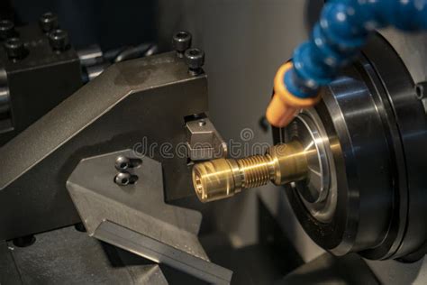 The Cnc Lathe Or Turning Machine Cutting The Thread At The Brass Shaft