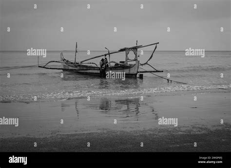 Asian Fishermen Prepare To Work On Traditional Fishing Boats Floating