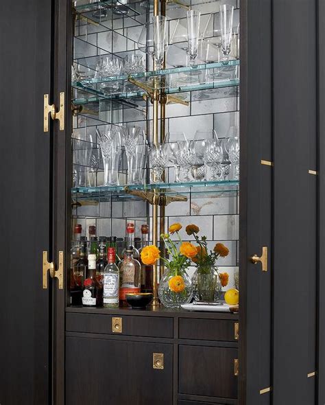 Dark Stained Bar Cabinet With Mirrored Subway Tile Backsplash Contemporary Kitchen