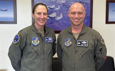 Husband Passes Guidon To His Wife During Rare Air Force Change Of