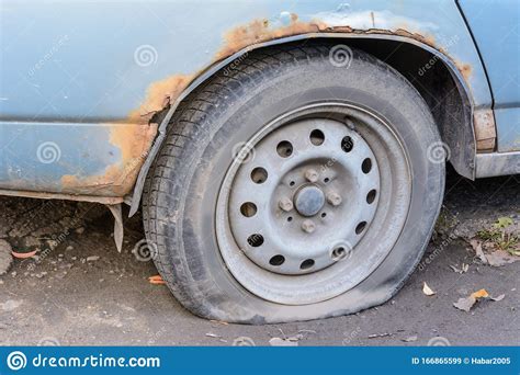 Damaged Tire The Wheel Of Car Tire Leak Flat Tire Waiting For Repair