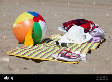 Beach Scene In The Summer With Flip Flops Beach Ball Towel