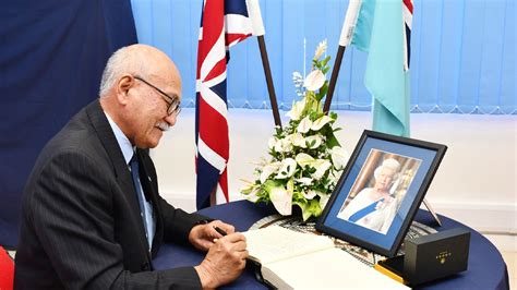 Former President Jioji Konrote signs the condolence book for the late Queen Elizabeth II