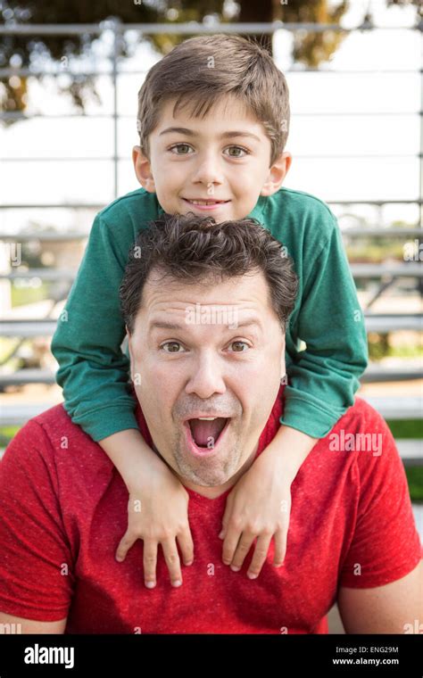 Caucasian Father And Son Playing On Bleachers Stock Photo Alamy