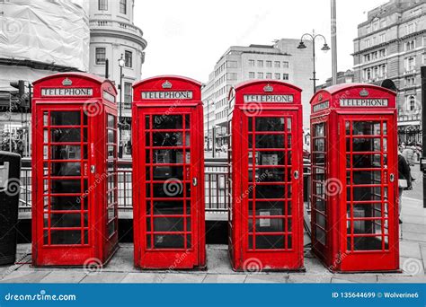 Four Traditional British Red Telephone Boxes Editorial Stock Image