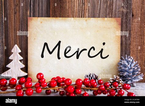 Paper With French Text Merci Means Thank You Christmas Decoration And