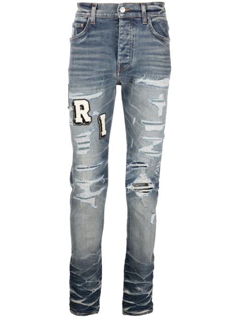 Amiri Varsity Ripped Skinny Jeans Farfetch