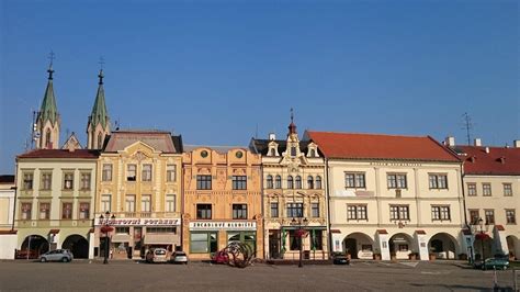 Several Old Buildings Line The Street In Front Of An Older Building