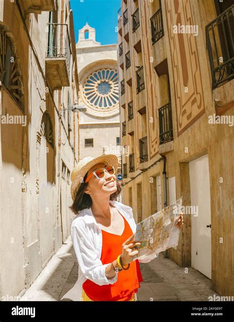 Happy tourist with map in Reus, Spain Stock Photo - Alamy