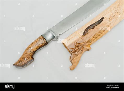 Indonesian traditional weapon called golok with carved wooden case Stock Photo - Alamy