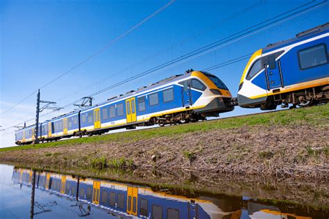 Train Of The Nederlandse Spoorwegen Ns Driving Through A Rural