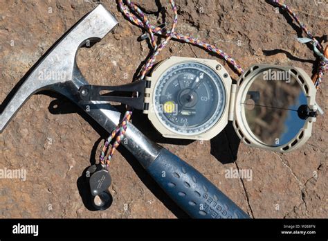 Field Geologist's tool kit: rock hammer, handlens, and compass Stock ...