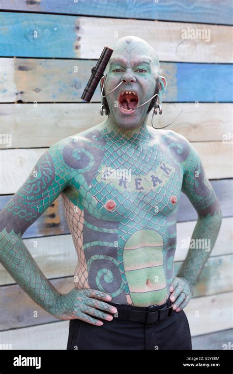 Performer lizardman from show london hi-res stock photography and ...