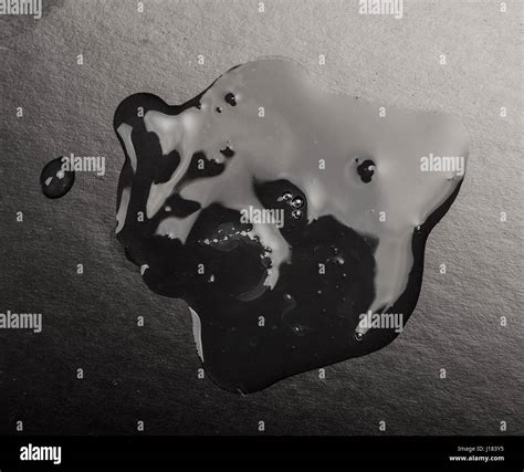 close  puddle  oil stock photo alamy