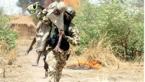 Nigerian Soldier Saves An Old Woman During A Gunfire With Boko Haram