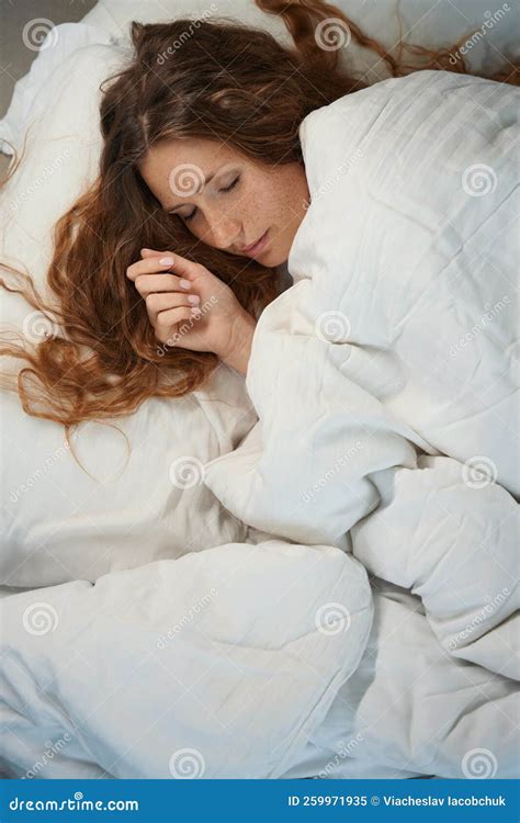 Woman Sleeps In Bed On Right Side Wrapped In Duvet Stock Image Image