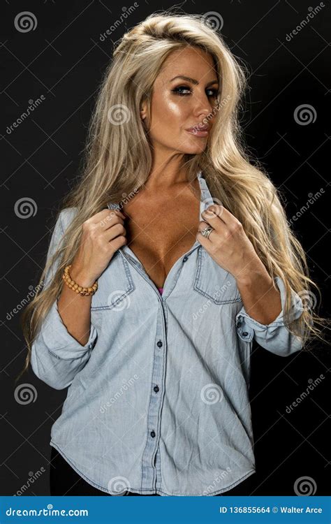 Beautiful Blonde Model Posing In A Studio Environment Stock Photo