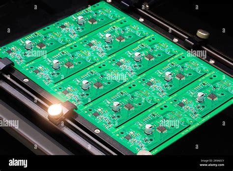 Close Up Of Examining Of Test Sample Of Microchip Transistor Under The