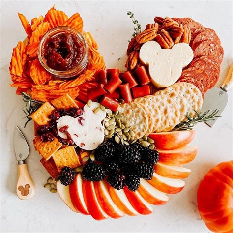 A Platter With Fruit Cheese And Crackers