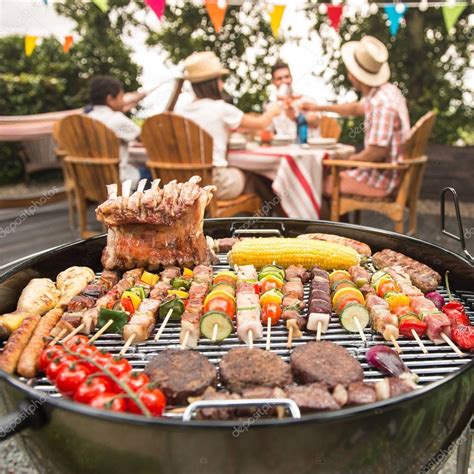 Family having a barbecue party in their garden Stock Photo by ©FreeProd ...