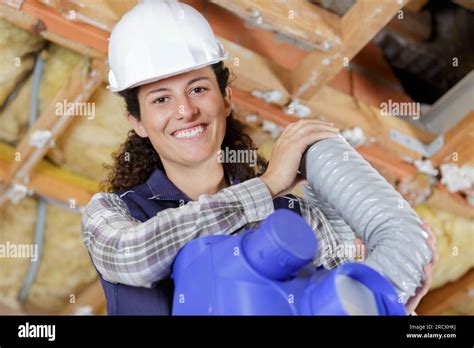 Happy Female Worker Holding Ventilation Pipes Stock Photo Alamy