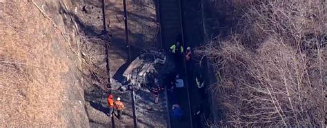 Two Killed After Bmw Plunges 500ft Off Parkway Onto Train Tracks And