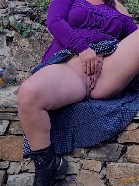 Solo BBW Nikki Holland Playing With Her Wet Pussy Outdoors Photos