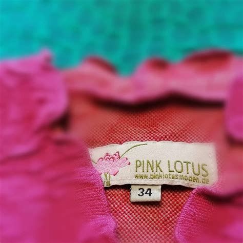 The Label On Pink Lotus S Dress Is Clearly Visible