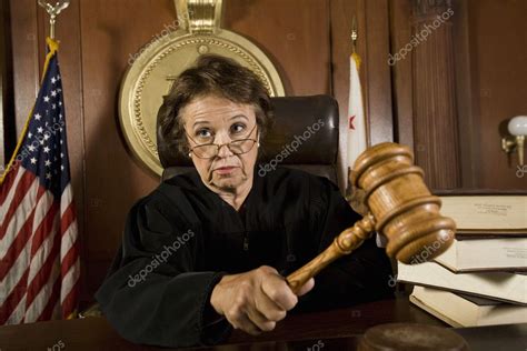 Judge Knocking A Gavel Stock Photo Londondeposit