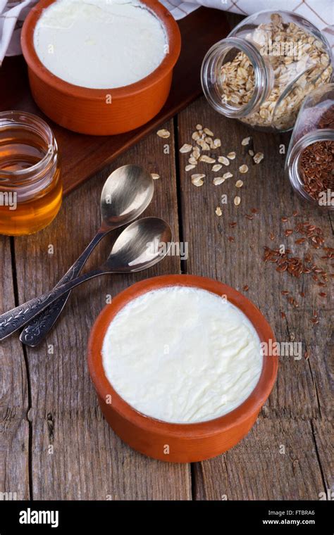 Home Made Greek Yogurt In Clay Pot As Traditional With Honeyoatmeal