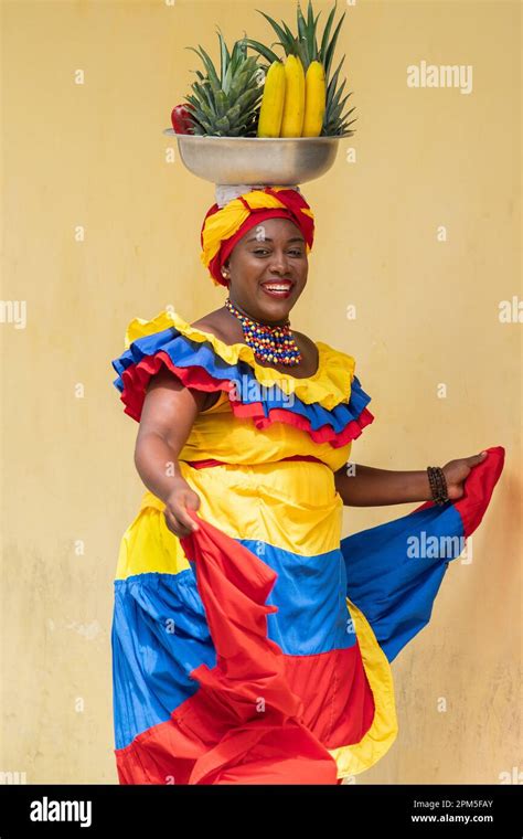 Happy Smiling Palenquera Fresh Fruit Street Vendor Dancing In Cartagena