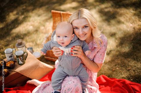 Blonde Mother Hugging A Cute Baby Son Stock Photo Adobe Stock