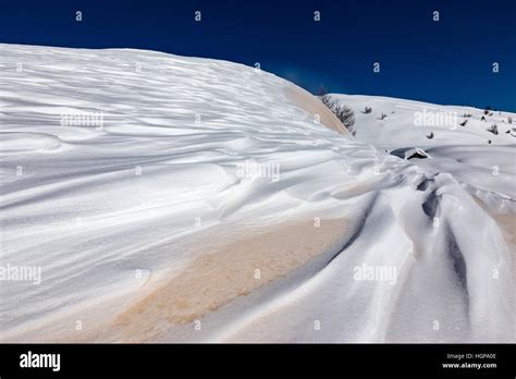 Sand Of The Sahara Desert On Snow Mountain Landscape In Winter Season