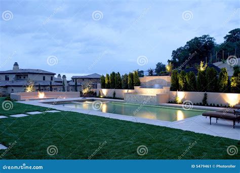 A Pool with a Waterfall in a Luxury Backyard Stock Image - Image of ...