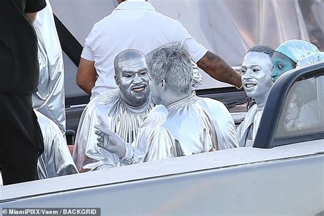 Kanye West Dons Silver Body Paint And Matching Bizarre Baggy Outfit At